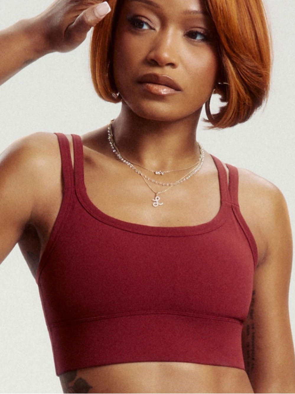 Fabletics Principal Longline Medium Impact Sports Bra in color Spice